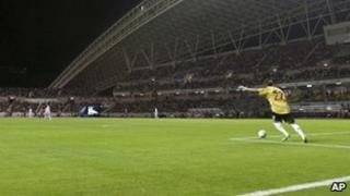 National team goal keeper Guan Zhen kicks the ball in a friendly against Costa Rica on 26 March 2011