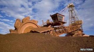 A loader prepares to shovel iron ore dug from an Australian mine