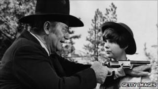 John Wayne with Kim Darby in True Grit