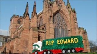 One of the many floral tributes in memory of Edward Stobart outside Carlisle cathedral
