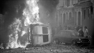 Burning police van