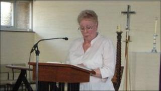 One of the parishioners reading from the King James Bible during the marathon reading