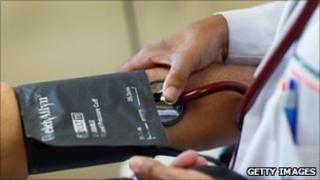 Blood pressure being taken