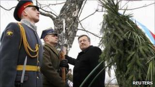 Poland's President Bronislaw Komorowski takes part in a commemoration ceremony at the site of a plane crash that killed former President Lech Kaczynski and 95 others, near Smolensk, 11 April 2011