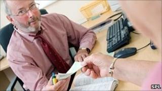 doctor handing over a prescription