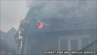 Firefighter tackling blaze on Tuesday, 12 April