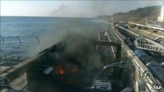 A small fire breaks out from facilities sampling seawater at the crippled Fukushima Daiichi nuclear power plant, 12 April.