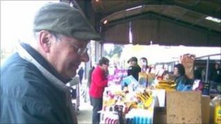 A customer browsing at the last Wednesday Henley Market