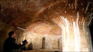 Artist arranging work in Round Tower