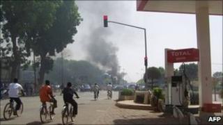 Smoke billows over Ouagadougou after traders riot in the Burkina Faso capital, 16 April