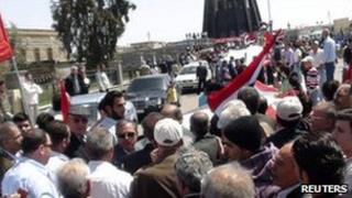People gather during a demonstration in the Syrian city of Suwaida, April 17, 2011.