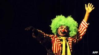 An Indian clown artist performs, 28 January 2011