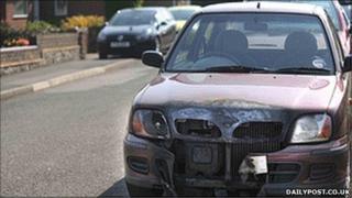 A car targeted in the latest arson attacks in Wrexham (picture: dailypost.co.uk)