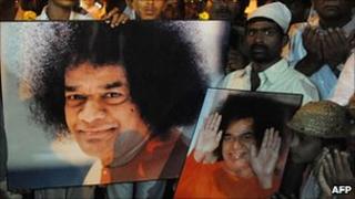 Devotees praying for Sai Baba's recovery