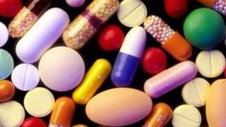 Mixture of coloured pills courtesy: EyeWire Inc.