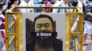 A poster of detained Chinese artist and activist Ai Weiwei at a protest in Hong Kong on 22 April 2011