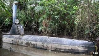 Colombian soldiers guard a homemade submersible in a rural area of Timbiqui in February 2011