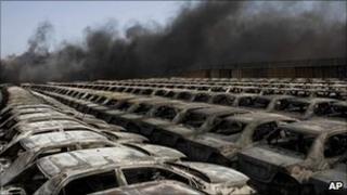Newly imported cars hit in the fighting between rebels and pro-Gaddafi forces in the Libyan port city of Misrata on Wednesday