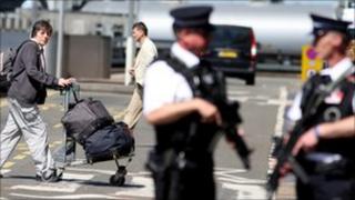 Police officers carry out routine searches of Heathrow's Terminal 1 as one of Osama bin Laden's high-profile supporters in the UK warned of another 7/7-style terror attack in the wake of his death