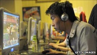 A man plays online games in Beijing