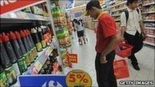 Customers shop at a Carrefour in Jakarta.