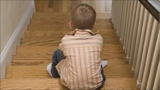 Boy sitting on stairs (model)