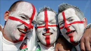 Rugby fans with faces painted in colours of St George's Cross