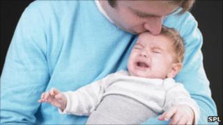 Dad with screaming baby