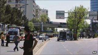 Police guard the area where a bomb exploded in Istanbul, 26 May