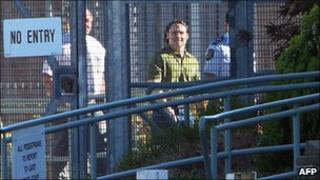 Former Guantanamo Bay inmate David Hicks (centre) walks to the exit at Adelaide's maximum security Yalata jail, 29 December 2007
