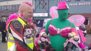 Bikers wearing pink bras