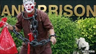 Anti-govt protester wears mock chains to highlight plight of jailed comrades 18 May 2011 Bangkok