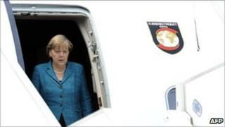 File picture of German Chancellor Angela Merkel disembarking from a plane after landing in France on 26 May 2011