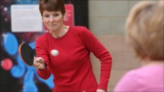 Woman playing table tennis