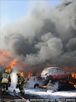Firefighters tackle a blaze at a scrapyard in Hereford