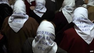 Members of the Madres de Plaza de Mayo wait for the lift at the Argentine defence ministry, May 2011.