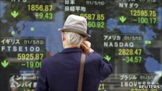 Investor looking at stock index