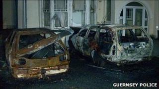 Burnt out cars by the Mandarin Car Park, Cobo, Guernsey