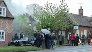 Villagers outside the burning hall in Nuneham Courtenay