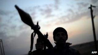 Armed man in silhouette