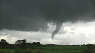 Funnel cloud over fields