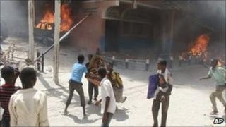 Protesters set fires outside the Medina hotel which accommodates Somali MPs on 10 June, amid on-going political turmoil in the country,