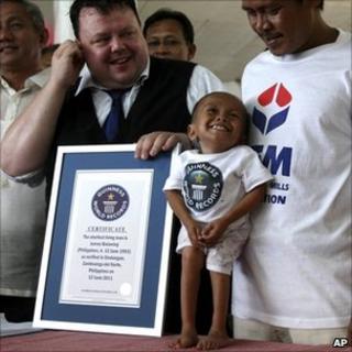 Junrey Balawing is presented with the Guinness World Records certificate declaring him the world's shortest man - 12 June 2011