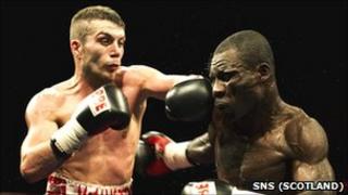 Lee McAllister lands a left on Isaac Quartey