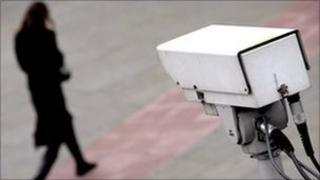 Woman watched by CCTV camera