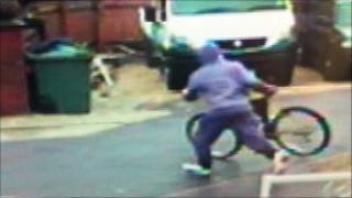Photograph of offender stealing bike