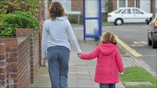 Mother walks with her daughter