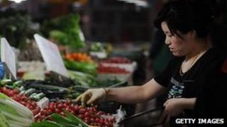 Consumer buying vegetables in China