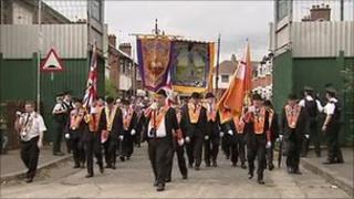 orangemen pass through peaceline on Workman avenue in west Belfast