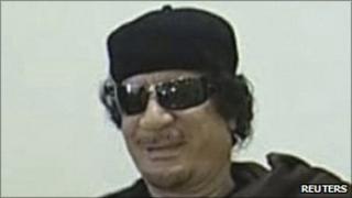 Muammar Gaddafi plays chess with Kirsan Ilyumzhinov, the president of the international chess federation, in Tripoli on 12 June, 2011 in a still image taken from Libyan state TV broadcast